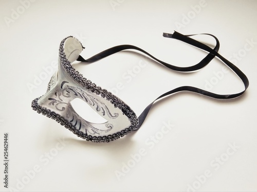 beautiful carnival silver mask with patterns on white background © maria