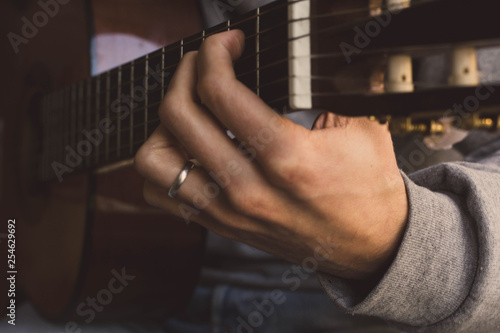 classic acustig guitar player performing, focus on hands