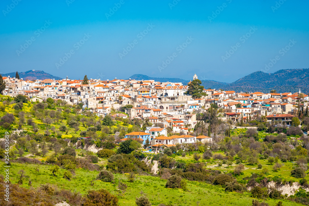 Amazing view of famous landmark tourist destination valley Pano Lefkara village, Larnaca, Cyprus known by ceramic tiled house roofs and Greek orthodox church