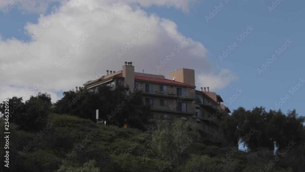 Building on a hilltop with airplane (slow motion). Building on a hilltop with airplane (slow motion).
