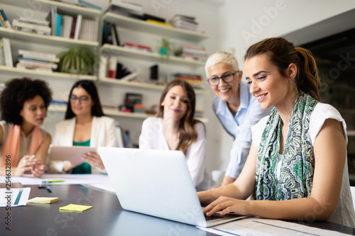 Group of successful business people at work in office