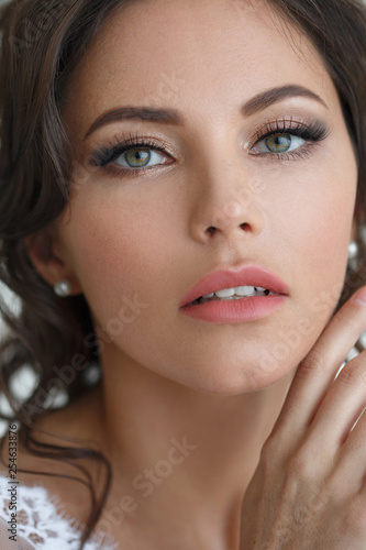 Beauty portrait of a beautiful girl with elegant wedding makeup.