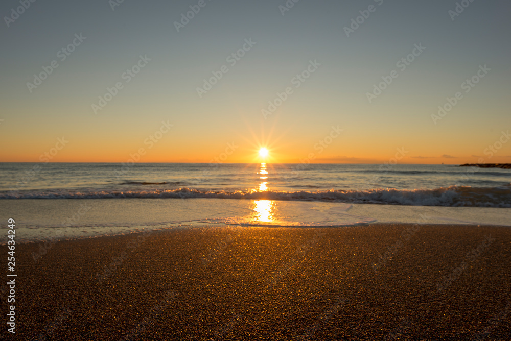 Naklejka premium Sunrise on a beach in Denia, Alicante