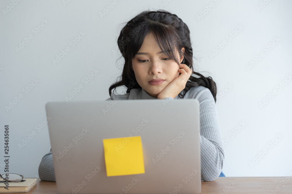 Asian women stressful working with a computer for a long time, Office syndrome concept Asian women stressful working with a computer for a long time, Office syndrome concept