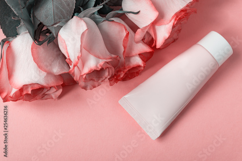 Wallpaper Mural Pink blooming roses and face cream on pastel pink background. Romantic skincare floral frame. Copy space Torontodigital.ca