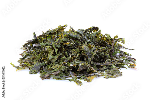 Heap of dry wakame seaweed isolated.