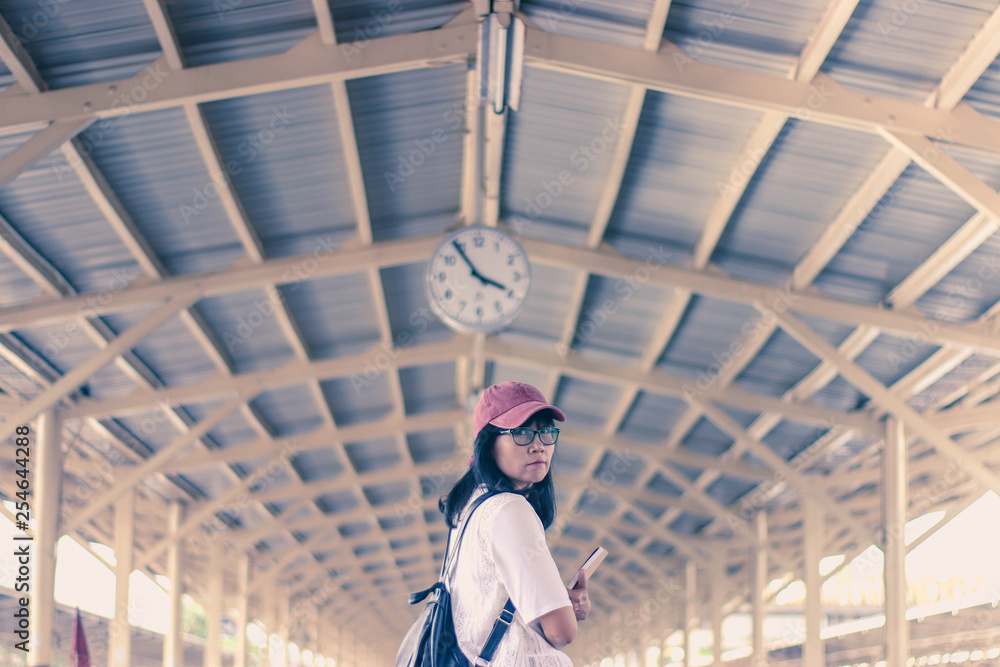 Travellers are travelling at the train station. Travellers are travelling at the train station.