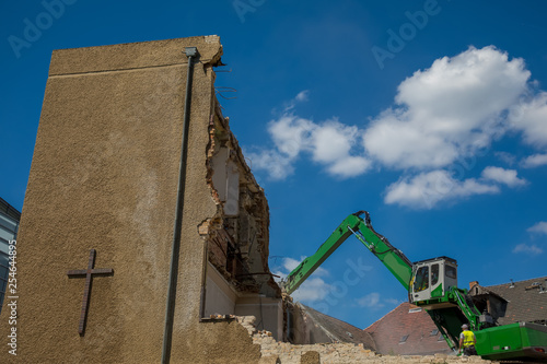 Tractor demolishing a church