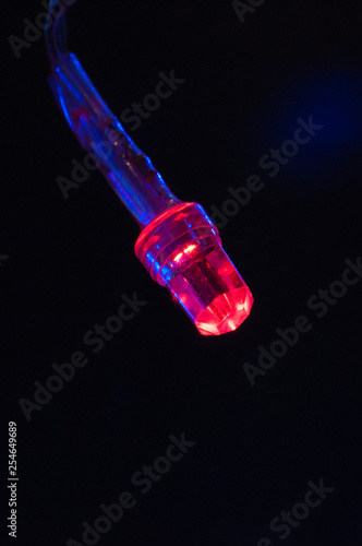 Red LED light Christmas garland close-up macro bokeh