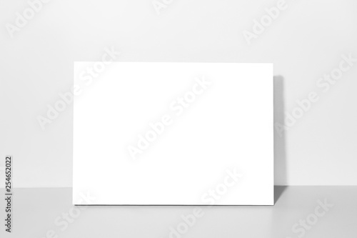 Photo Blank canvas, gray wall on background. Mockup poster frame.