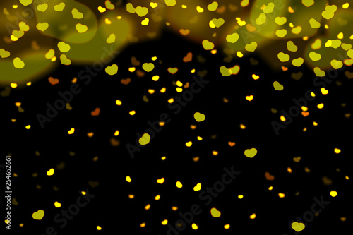 Gold and yellow hearts bokeh overlay, hearts photo overlay, abstract background, shiny gold and yellow hearts flowing around. Photo overlay effect, hearts bokeh on black background, JPG file.