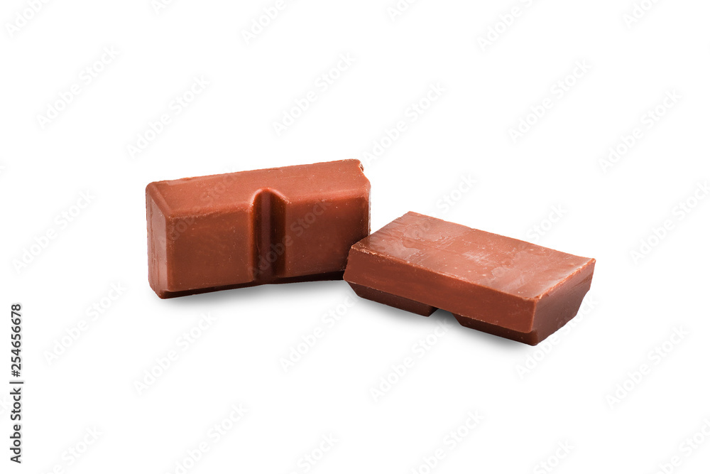 Macro photo of Chocolate bar. Broken pieces over white background Macro photo of Chocolate bar. Broken pieces over white background