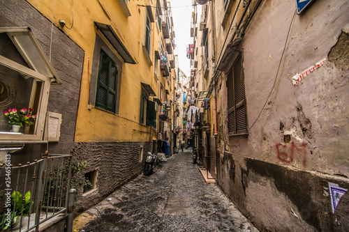 Fototapeta Naklejka Na Ścianę i Meble -  NAPLES, ITALY - November, 2018: Classical romantic small street in the historical center of Naples, Italy. Naples is the the third-largest city in Italy with about 1 million residents