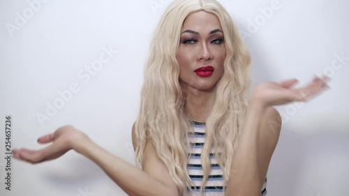 Funny shot of a beautiful transgender woman doing a sarcastic slow clap indoors