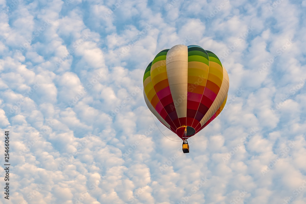Colorful hot air balloons floating above the lake with blue sky in Singha Park ,Chiang Rai, Thailand. Colorful hot air balloons floating above the lake with blue sky in Singha Park ,Chiang Rai, Thailand.