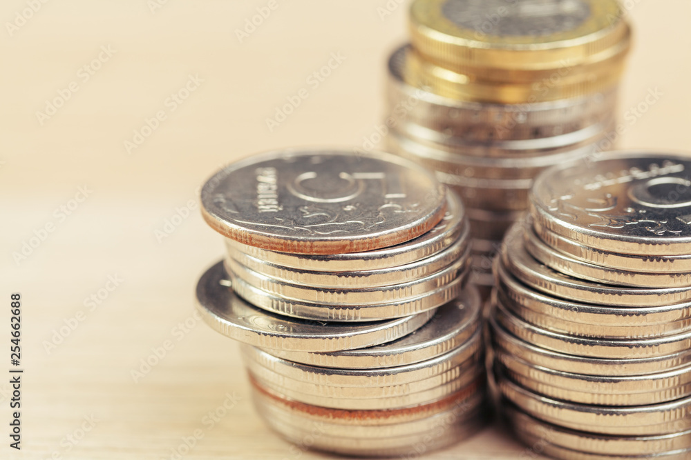 piles of coins on working table piles of coins on working table