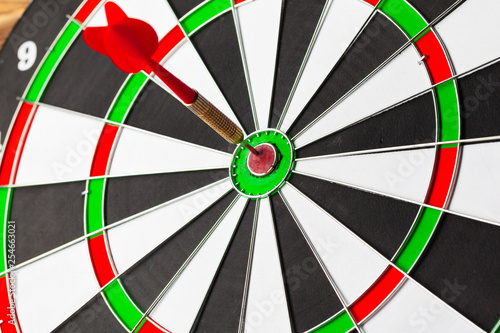 The darts on wooden background