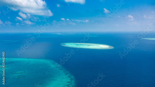 Aerial view of Maldives atolls is the world top beauty. Maldives tourism. Exotic aerial landscape in Maldives islands