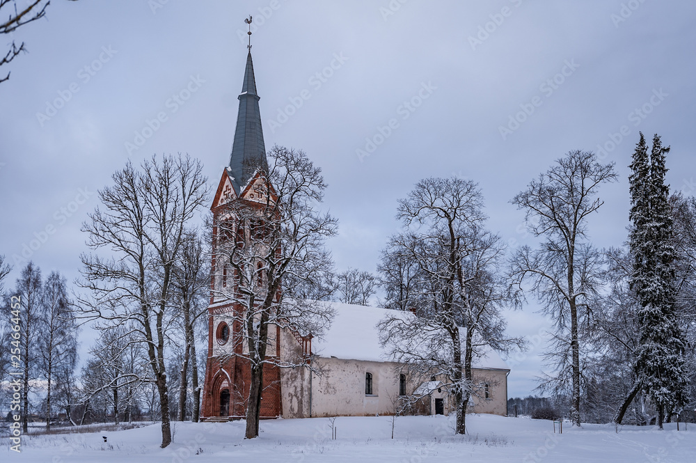 Krimulda Evangelical Lutheran Church on the hill in the wintertime. Krimulda, Latvia.