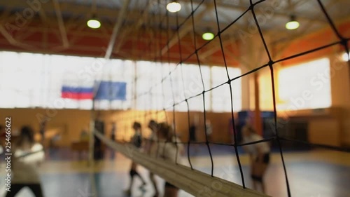 High School Volleyball Match In Gymnasium