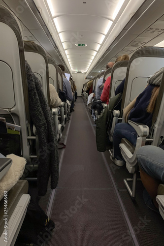 rear view of people in a passenger plane