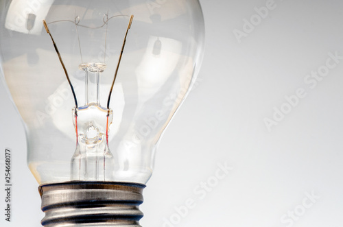 Business success and innovation concept, closeup shot image of light bulb over gray background