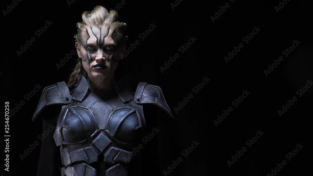 An alien woman with face paint, dreadlocks and white eyes is turning, 4k An alien woman with face paint, dreadlocks and white eyes is turning, 4k