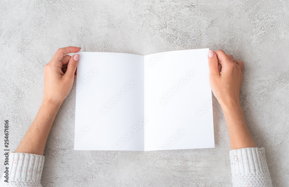 Girl' hands with molded sheet of paper Girl' hands with molded sheet of paper