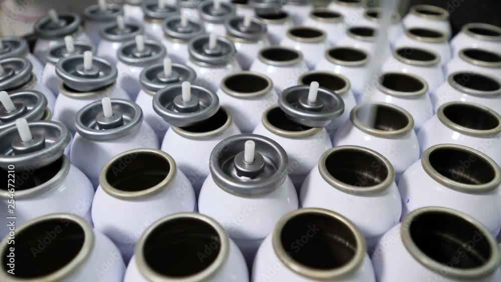 Installation of sprayer and caps on aerosol cans Installation of sprayer and caps on aerosol cans