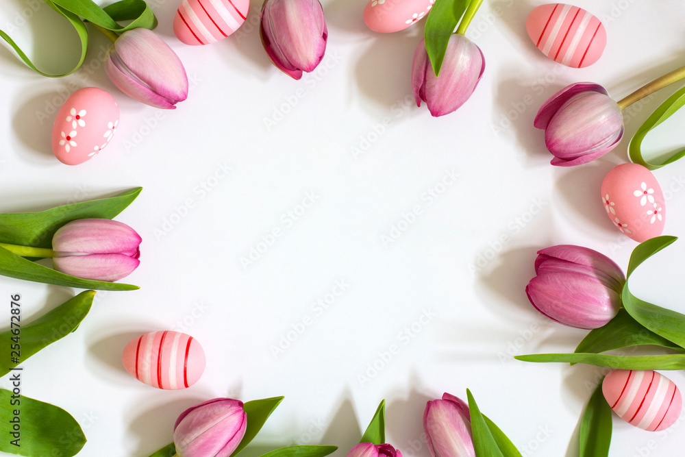Fototapeta Tulips and Easter eggs on a white background