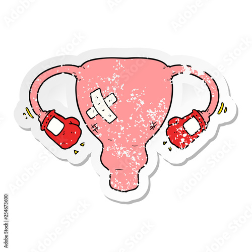 distressed sticker of a cartoon beat up uterus with boxing gloves photo