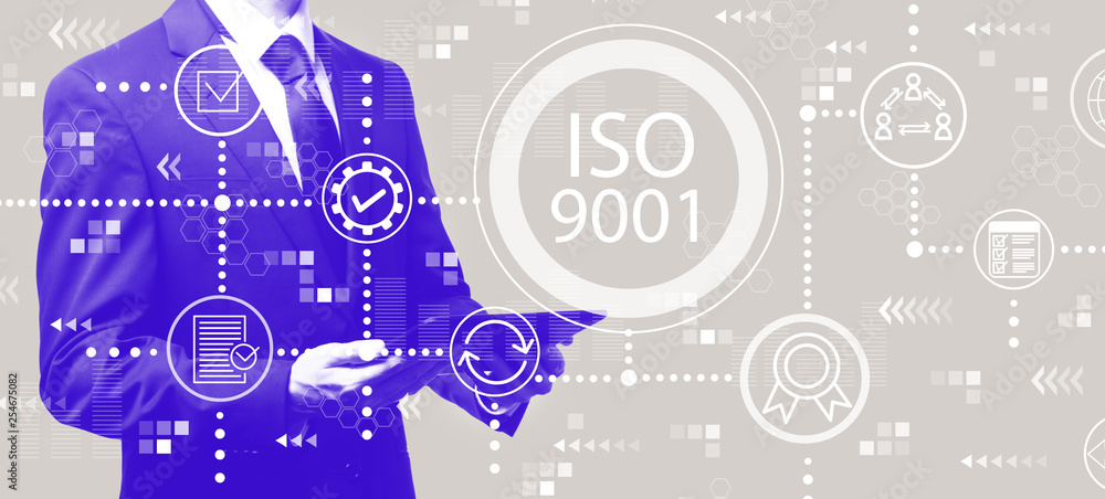 ISO 9001 with businessman holding a tablet computer ISO 9001 with businessman holding a tablet computer