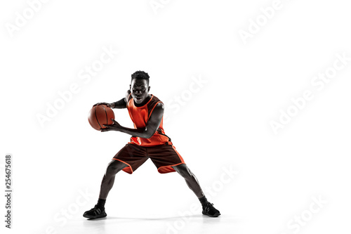Full length portrait of a basketball player with a ball isolated on white studio background. advertising concept. Fit african anerican athlete with ball. Motion  activity  movement concepts.