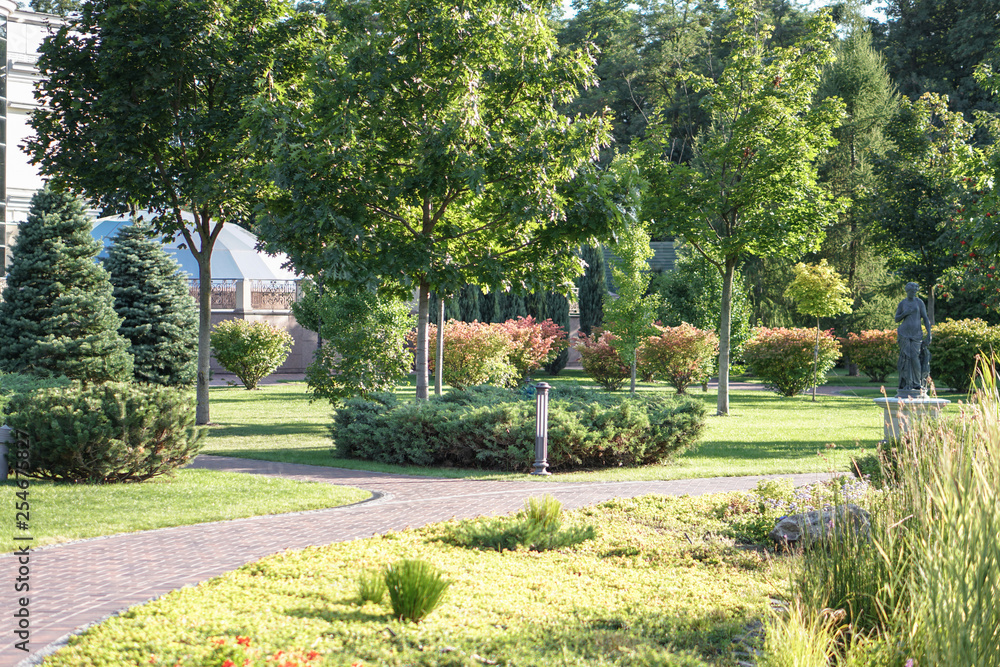 Beautiful garden in the park. Path in nature for jogging and recreation. Stock photo Beautiful garden in the park. Path in nature for jogging and recreation. Stock photo