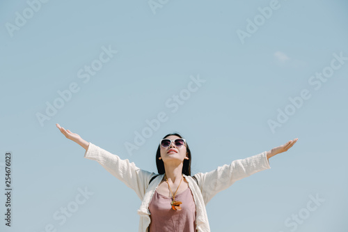 Female tourists spread their arms and held their wings, smiling happily.