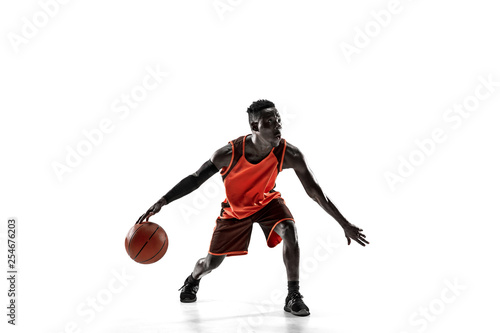 Full length portrait of a basketball player with a ball isolated on white studio background. advertising concept. Fit african anerican athlete with ball. Motion, activity, movement concepts. © master1305