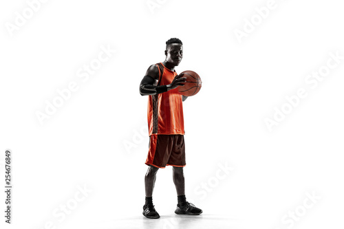 Full length portrait of a basketball player with a ball isolated on white studio background. advertising concept. Fit african anerican athlete standing with ball. © master1305