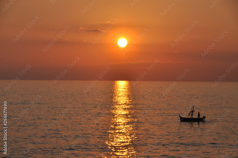 fishing boat at sunset in Camogli, Genoa province, Liguria, Italy