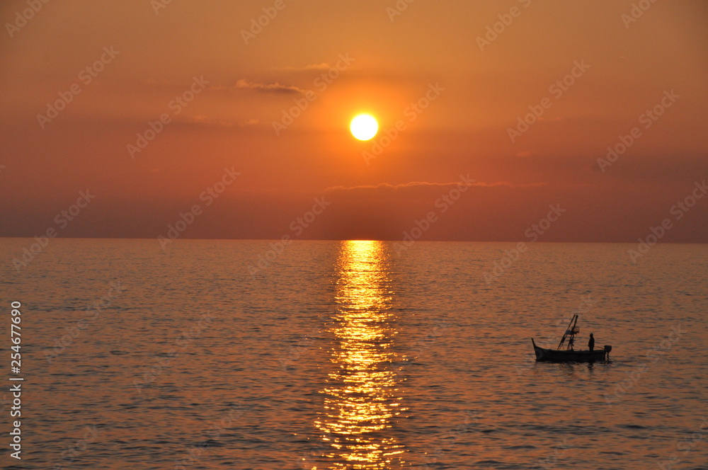 fishing boat at sunset in Camogli, Genoa province, Liguria, Italy fishing boat at sunset in Camogli, Genoa province, Liguria, Italy