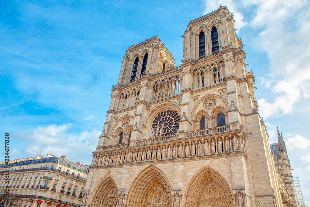 Cathedral Notre-Dame de Paris against blue sky 