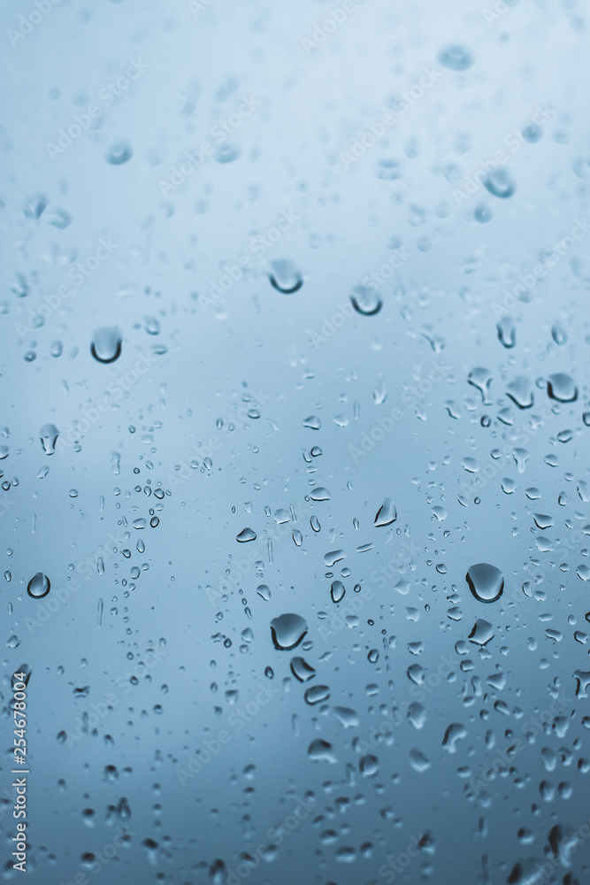 Raindrops on glass - Blue / cool colors - cold wet weather Raindrops on glass - Blue / cool colors - cold wet weather