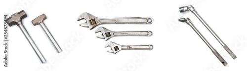Set of various metal heavy duty industrial hand tools on a isolated white background - mallet hammer adjustable wrench and ratcheting socket wrench ratchet equipment