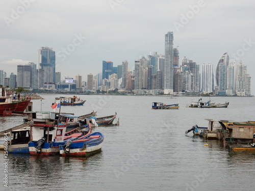 Panama city skyline in a cloudy day with fishing boats moored in the bay, Panama, Central America © SIMONE