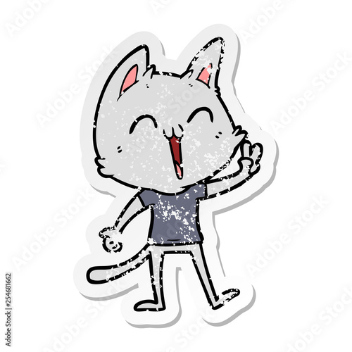 distressed sticker of a happy cartoon cat meowing
