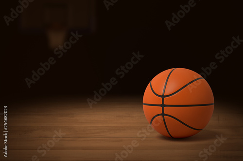 3d rendering of a basketball on the wooden floor of a dimly lit gym.