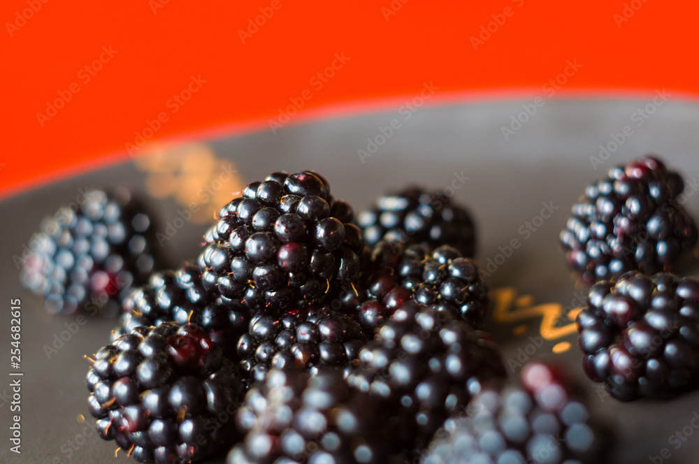 large juicy blackberry berries on a ceramic plate large juicy blackberry berries on a ceramic plate