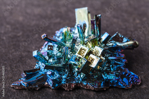 Close macro photograph of an artificially synthesized bismuth crystal