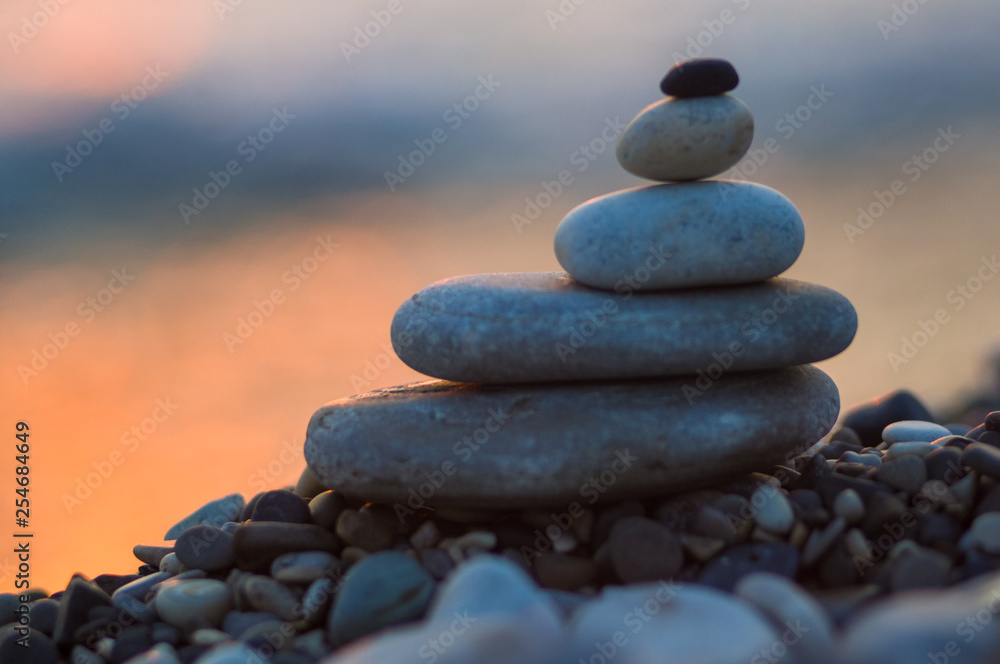 stack of zen stones on pebble beach stack of zen stones on pebble beach
