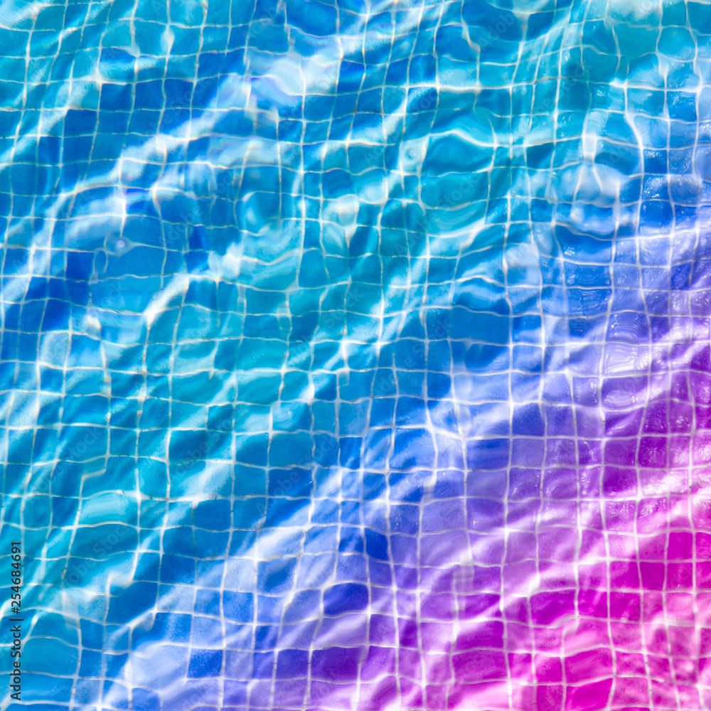 Obraz premium water ripples in swimming pool, blue and purple background