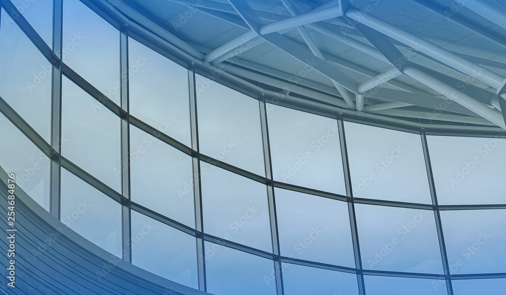 Obraz premium Architecture of metal structure and glass windows in blue color tone
